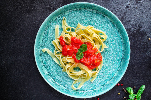pasta with herbs and tomato sauce - Fotó, kép