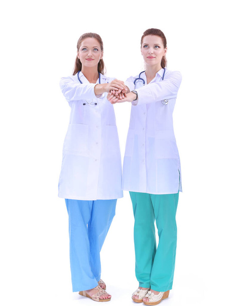 Two young woman doctor , standing in hospital. Two young woman doctor. - Foto, afbeelding