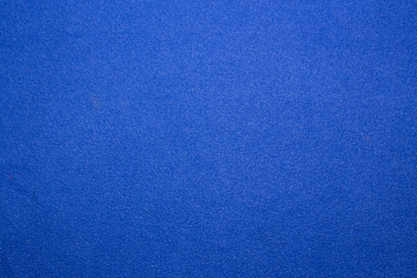 Textuur van fijn blauw synthetisch weefsel - Foto, afbeelding