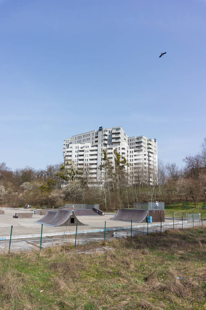 POZNAN, POLAND - Apr 03, 2016: Skate and bmx platforms area with high apartment block in the background - Fotoğraf, Görsel