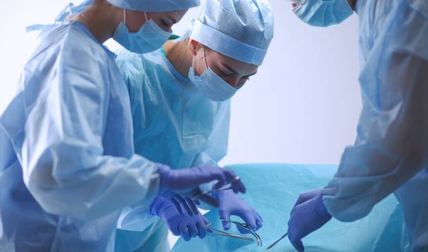 Team surgeon at work in operating room. - Foto, imagen