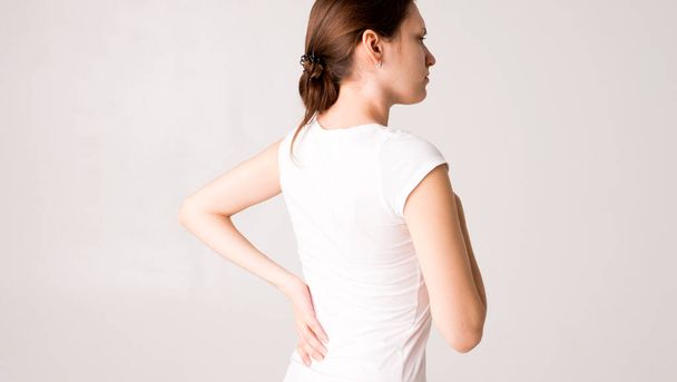 Tired woman feeling neck pain, massaging tense muscles - Foto, Bild