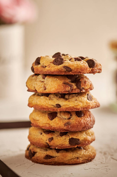 A closeup shot of chocolate chip cookies - Fotó, kép