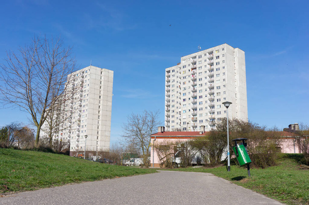 POZNAN, POLAND - Apr 02, 2016: Park footpath leading to high apartment blocks at the Orla Bialego area - Fotoğraf, Görsel