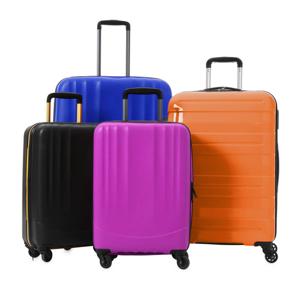 Modern suitcases for travelling on white background - Foto, imagen