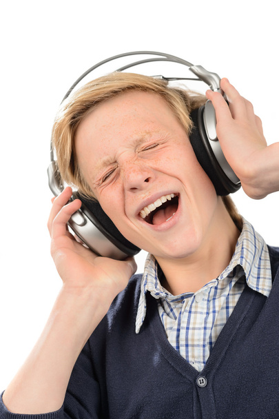 Teenage boy enjoy music from headphones - Fotó, kép