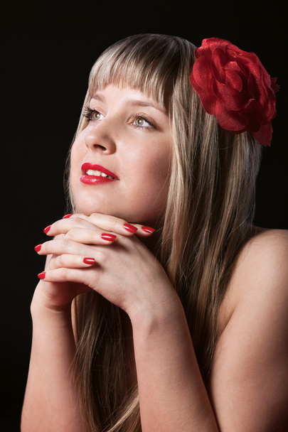Happy Blond With Red Flower in hair - Фото, изображение