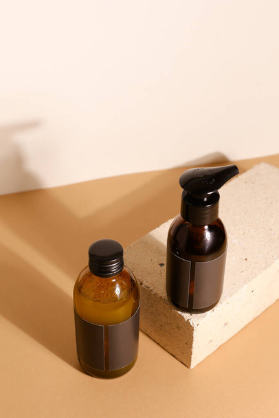 Amber glass dispenser bottle, sprayer and moisturizer cream jar. Natural cosmetic products packaging design template, branding - Valokuva, kuva