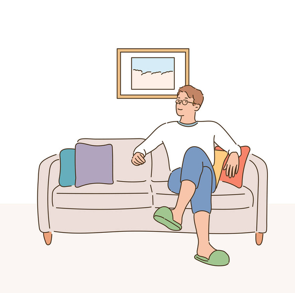 A man is sitting comfortably on the sofa. - Vektör, Görsel