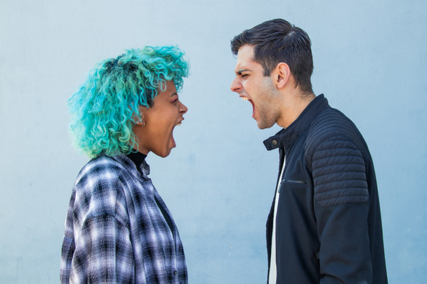 couple fighting or arguing furiously in the street - Photo, Image