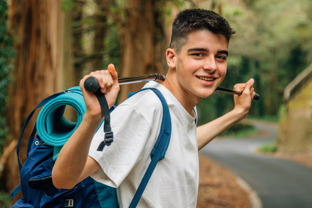 boy with backpack hiking or pilgrimage - Photo, Image