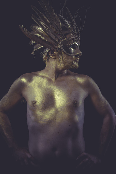 Man with wings and gold helmet - Foto, Imagen