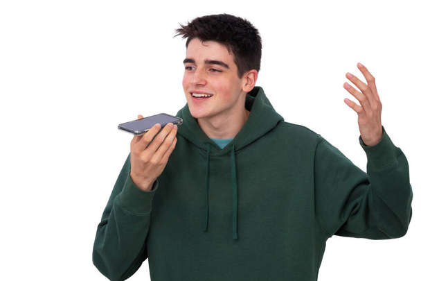 aislado joven adolescente niño hablando en el teléfono móvil con las manos libres - Foto, imagen