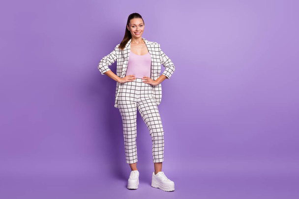 Full size photo of young beautiful lovely pretty businesswoman in checkered suit isolated on violet color background - Foto, Imagen