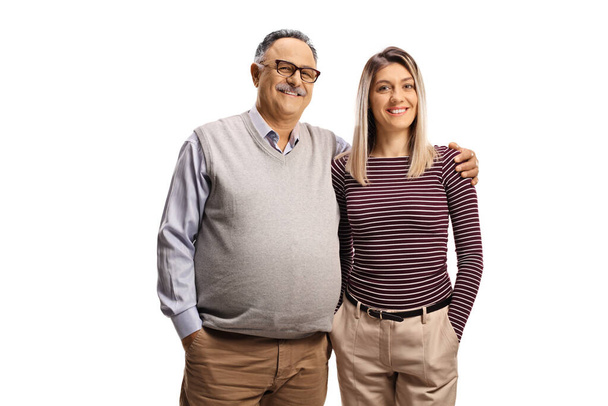 Young woman and a smiling mature man posing isolated on white background - Foto, immagini