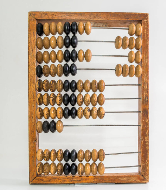 Old wooden abacus on pure white background - Photo, Image