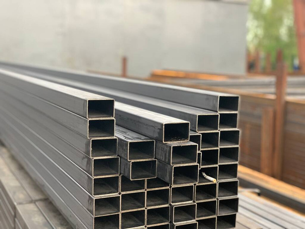 Rectangular steel pipes. Steel profile rectangular pipe at the warehouse of metal products. - Photo, Image