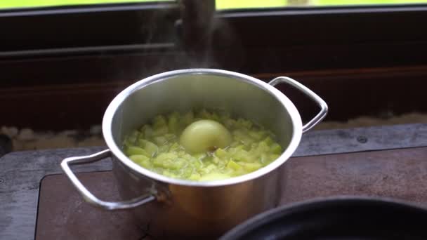 potato soup is cooked in a saucepan - Footage, Video