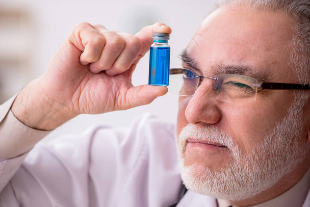 Old male doctor in vaccination concept - Photo, Image