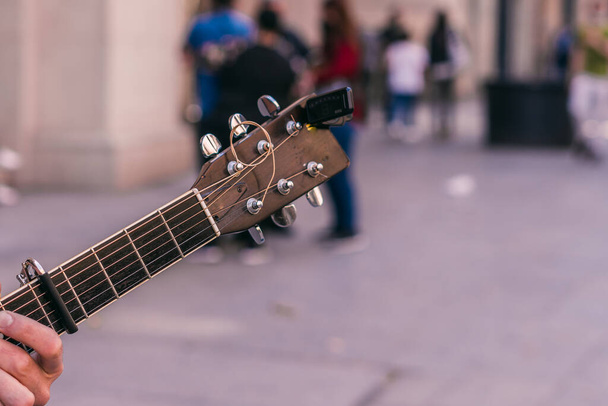 Street musician guitar neck - Фото, изображение