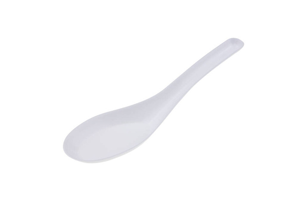 Cucchiaio di plastica bianca per raccogliere il cibo isolato su sfondo bianco - Foto, immagini