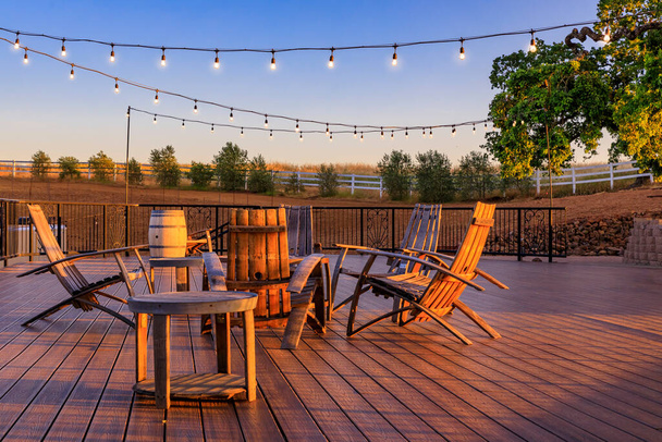 Outdoor table with chairs on a wooden deck in the spring in Napa Valley, California USA - Photo, Image