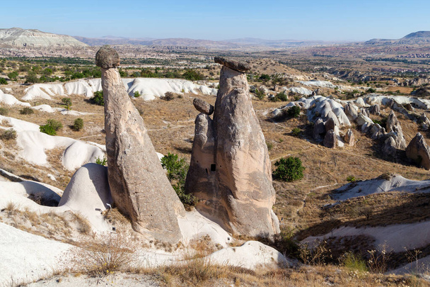 URGUP, TURKEY - OCTOBER 4, 2020: These are the famous stone pillars Three Beauties in Cappadocia. - Foto, afbeelding