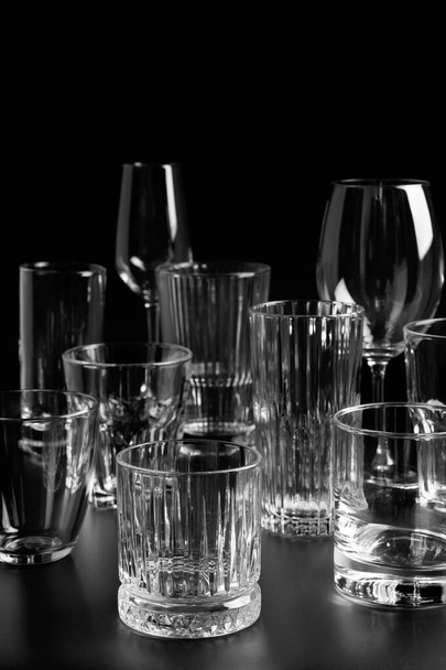 Transparent glasses on black background - Fotoğraf, Görsel