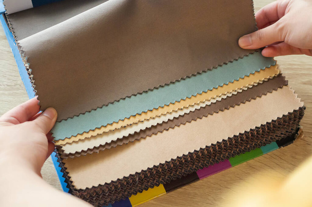 female designer with fabric color samples choosing textile for curtains - Fotografie, Obrázek