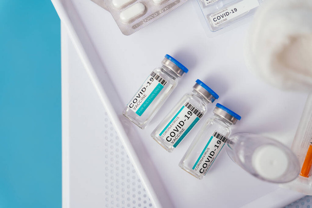 Close-up on covid-19 bottles and medication boxes - Coronavirus vaccination campaign - 写真・画像