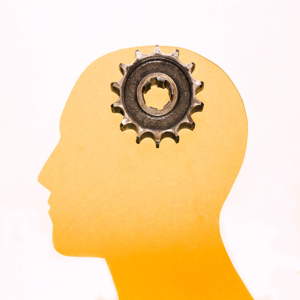 Gears. Cogwheels in the form of a human head on a white background. Business innovation. - Foto, Bild