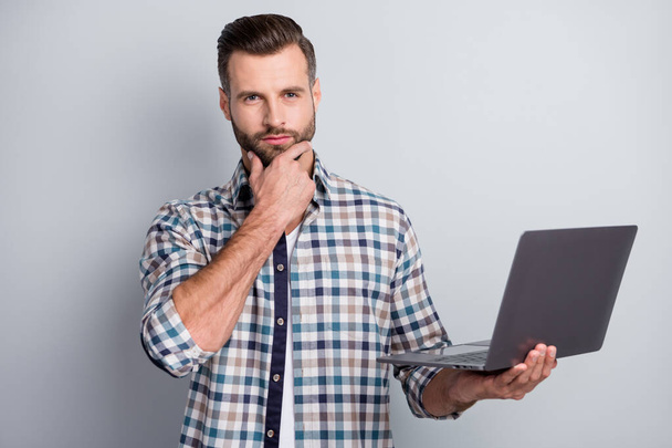 Portrait of attractive skilled content bearded guy holding in hand using laptop it isolated over gray pastel color background - Φωτογραφία, εικόνα