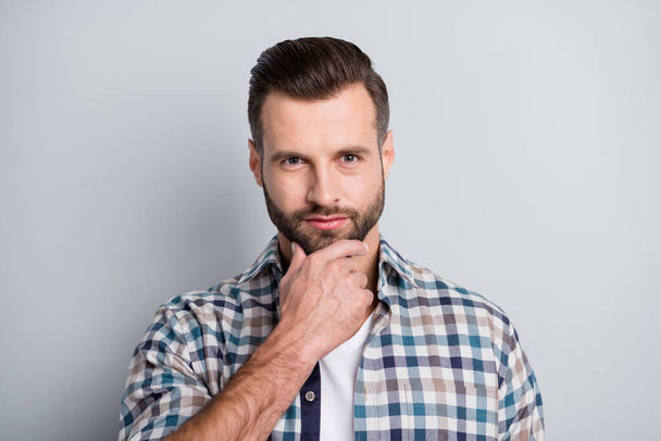Photo portrait of thoughtful man wearing plaid shirt touching chin isolated on grey color background - Foto, immagini