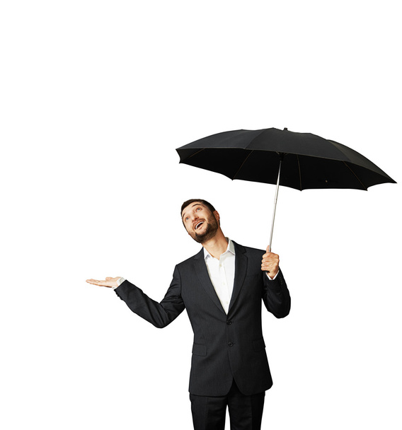 man with umbrella looking up - Фото, зображення