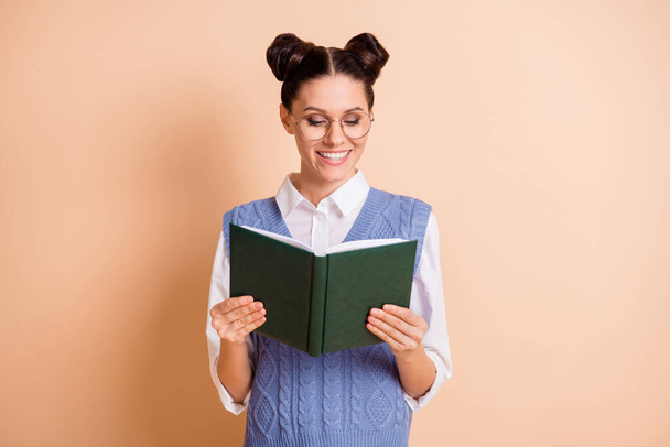 Photo of nice hairdo charming lady enjoy reading book beaming smile isolated on beige color background - Foto, Bild