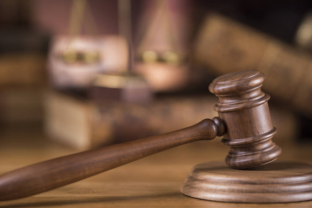 Law theme, mallet of judge, wooden gavel, globe background - Photo, Image