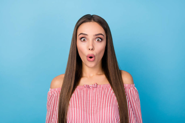 Portrait of astonished girl speechless voiceless look good wear modern clothes isolated over blue color background - Fotó, kép
