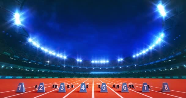 Modern Atletizm Stadyumu 'nda parlayan ışıklar ve koşu pistinde bloklar var. Profesyonel spor 4k video arkaplanı. - Video, Çekim