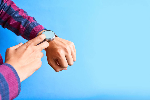 Man wear smart watch in everyday lifestyle. - 写真・画像