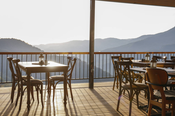 Empty terrace of a restaurant in the mountains. Close up, copy space for text, background. - Фото, зображення