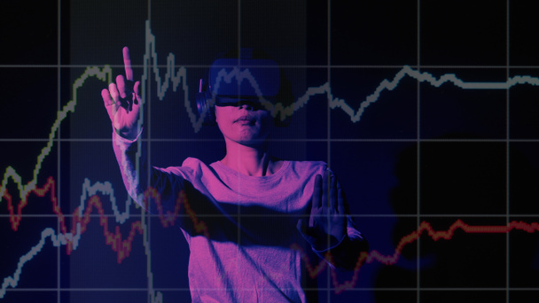 Businesswoman with VR headset in Virtual stock market. Finger touching a virtual display with graph. Stock statistics. represent investment in virtual cryptocurrency stock market. stock market data. - Foto, Imagen