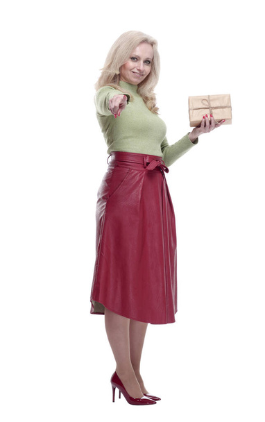 elegant woman with a gift box pointing at you. - Zdjęcie, obraz