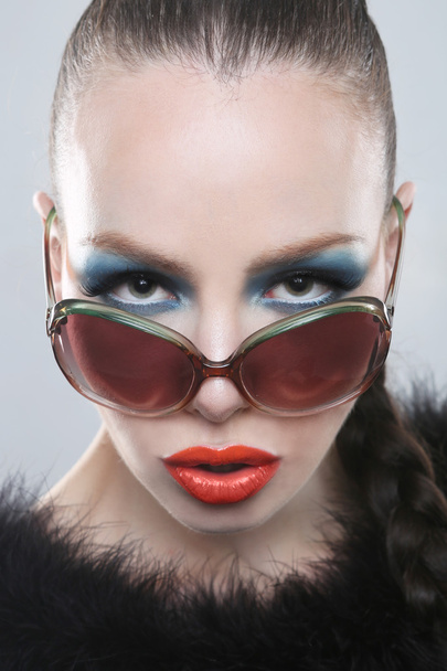 Stylish Woman With Beauty Makeup and Sunglasses - 写真・画像