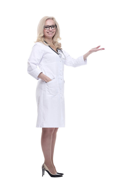 smiling female doctor pointing at a white blank screen - Valokuva, kuva
