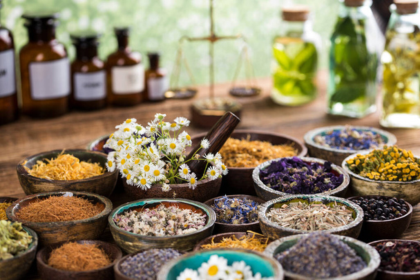 Natural medicine and mortar, healing herbs background - Photo, Image