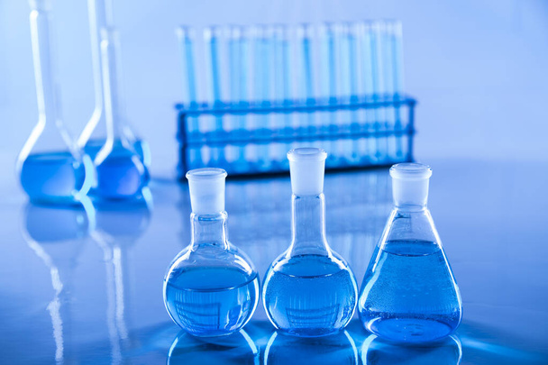 Laboratory equipment, glass filled background - Фото, изображение