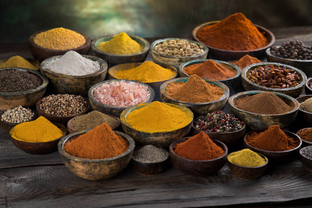 Spices and herbs in wooden bowl Colorful spices - Photo, Image