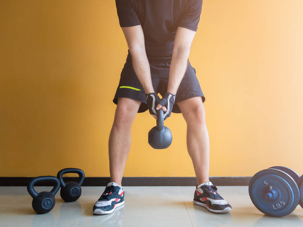 Stock photo of a unrecognizable man exercising with kettlebell - Foto, Imagem