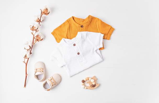 Gender neutral baby garment and accessories. Organic cotton clothes, newborn fashion - Photo, Image
