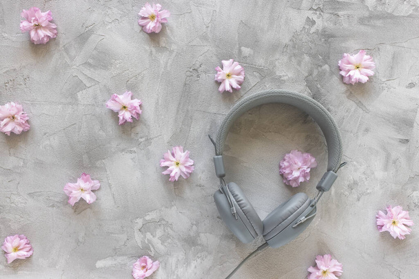 Headphones on gray spring or summer background - Photo, image